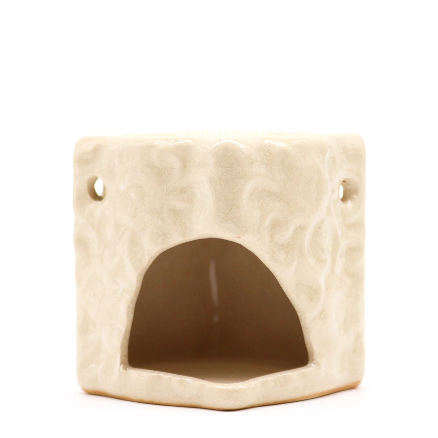Small square terracotta-style ceramic oil burner with a delicate floral cutout design on a rustic finish.