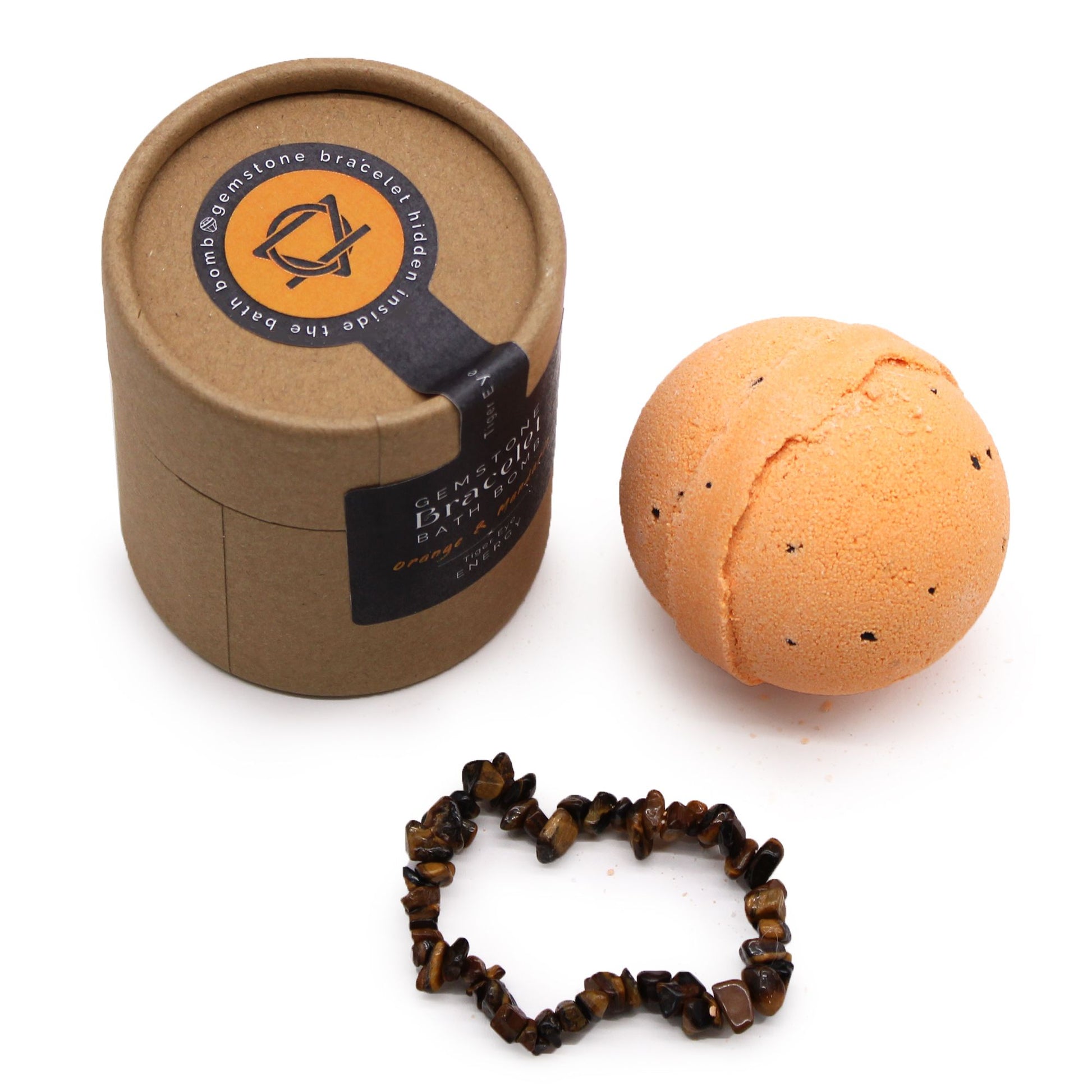 Artisanal round bath bomb with orange speckles next to a polished Tiger Eye gemstone beaded bracelet.