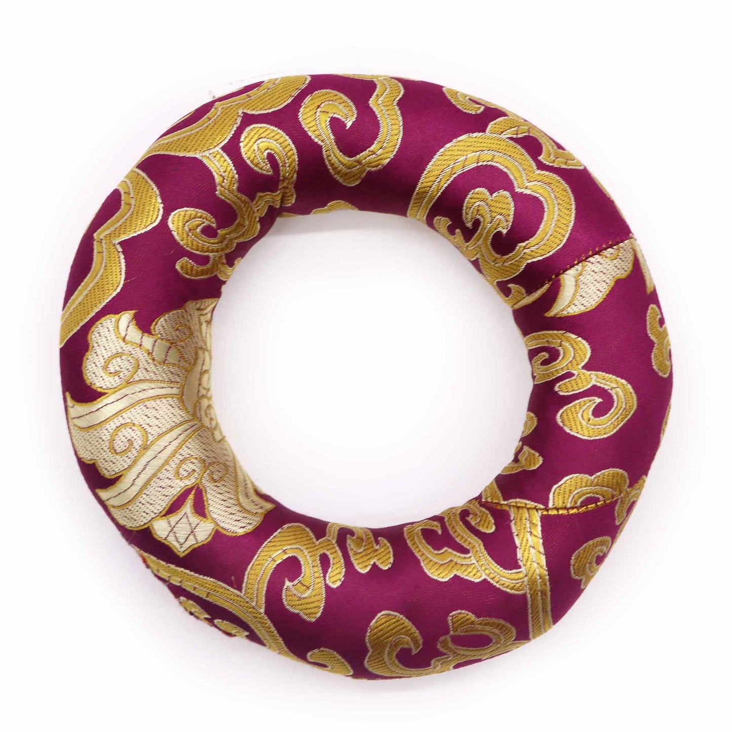 Circular fabric hoop cushion for supporting a singing bowl, shown in a vibrant assorted colour with traditional patterns.
