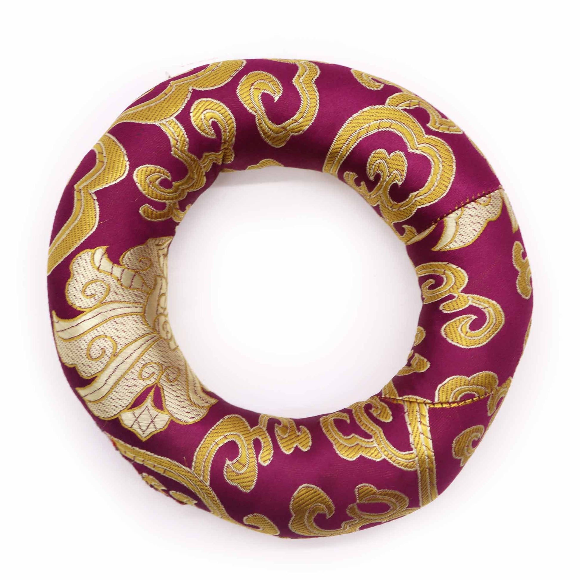 Circular fabric hoop cushion for supporting a singing bowl, shown in a vibrant assorted colour with traditional patterns.