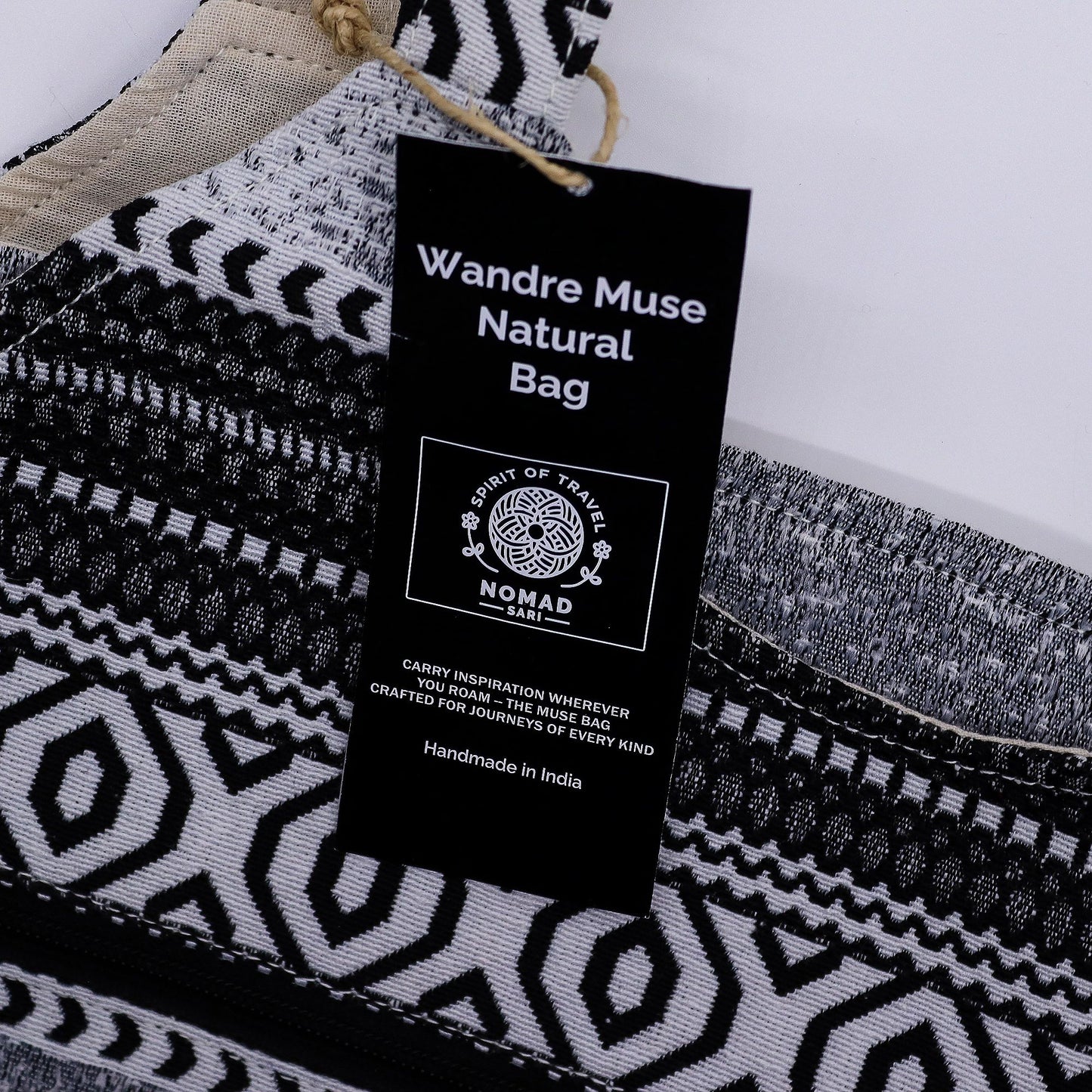 Roomy monochrome jacquard fabric tote bag with a modern geometric pattern and magnetic clip closure.