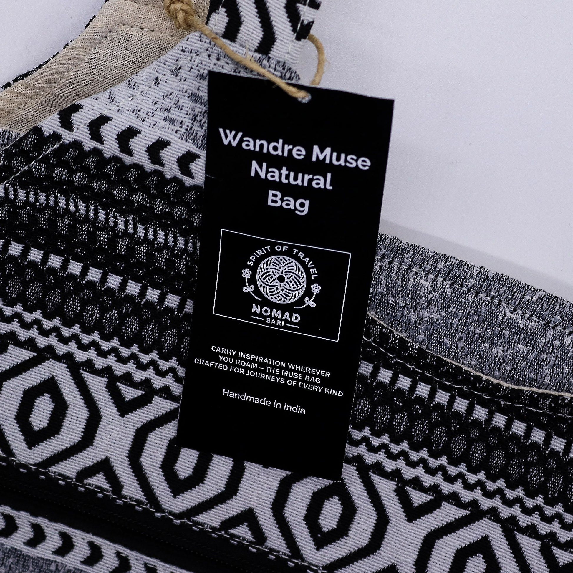 Roomy monochrome jacquard fabric tote bag with a modern geometric pattern and magnetic clip closure.