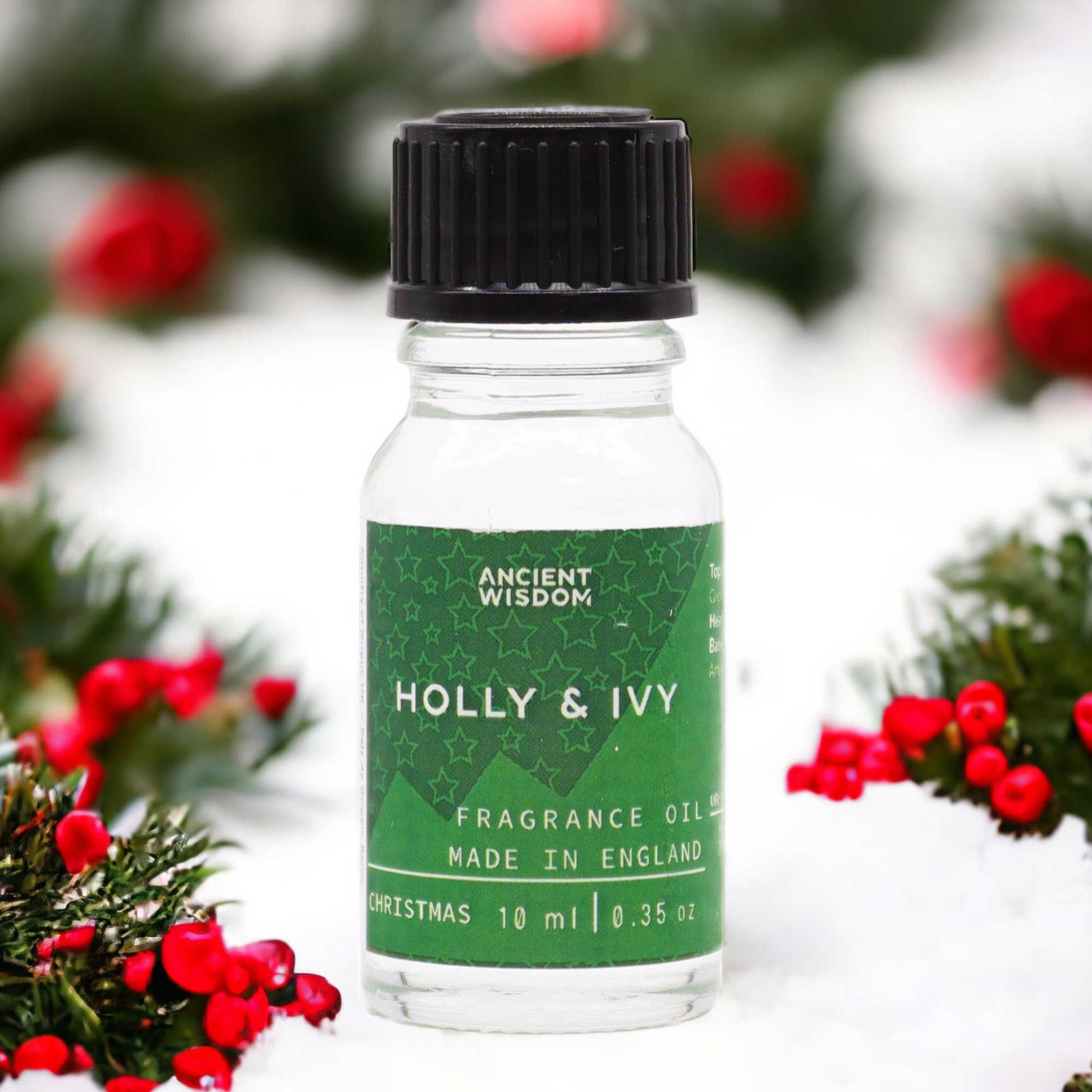 A 10ml glass bottle of festive Holly and Ivy fragrance oil with a simple dropper cap.