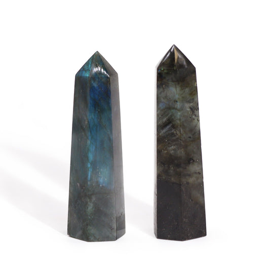 Sleek, polished Madagascar Labradorite crystal point showing shimmering iridescent blue and green flashes.