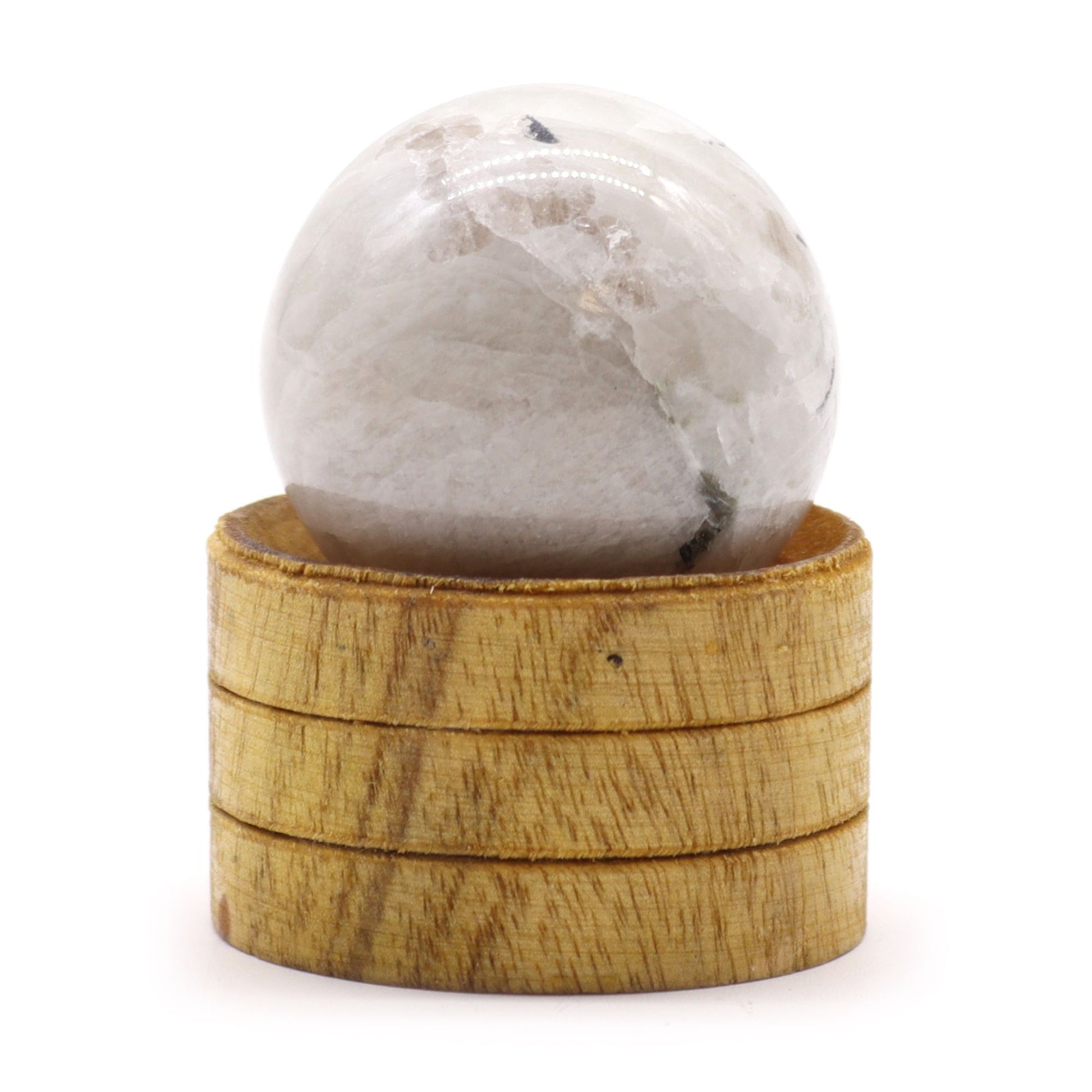 A smooth, polished 40mm Indian moonstone sphere with pearly white and grey tones resting on a small wooden stand.