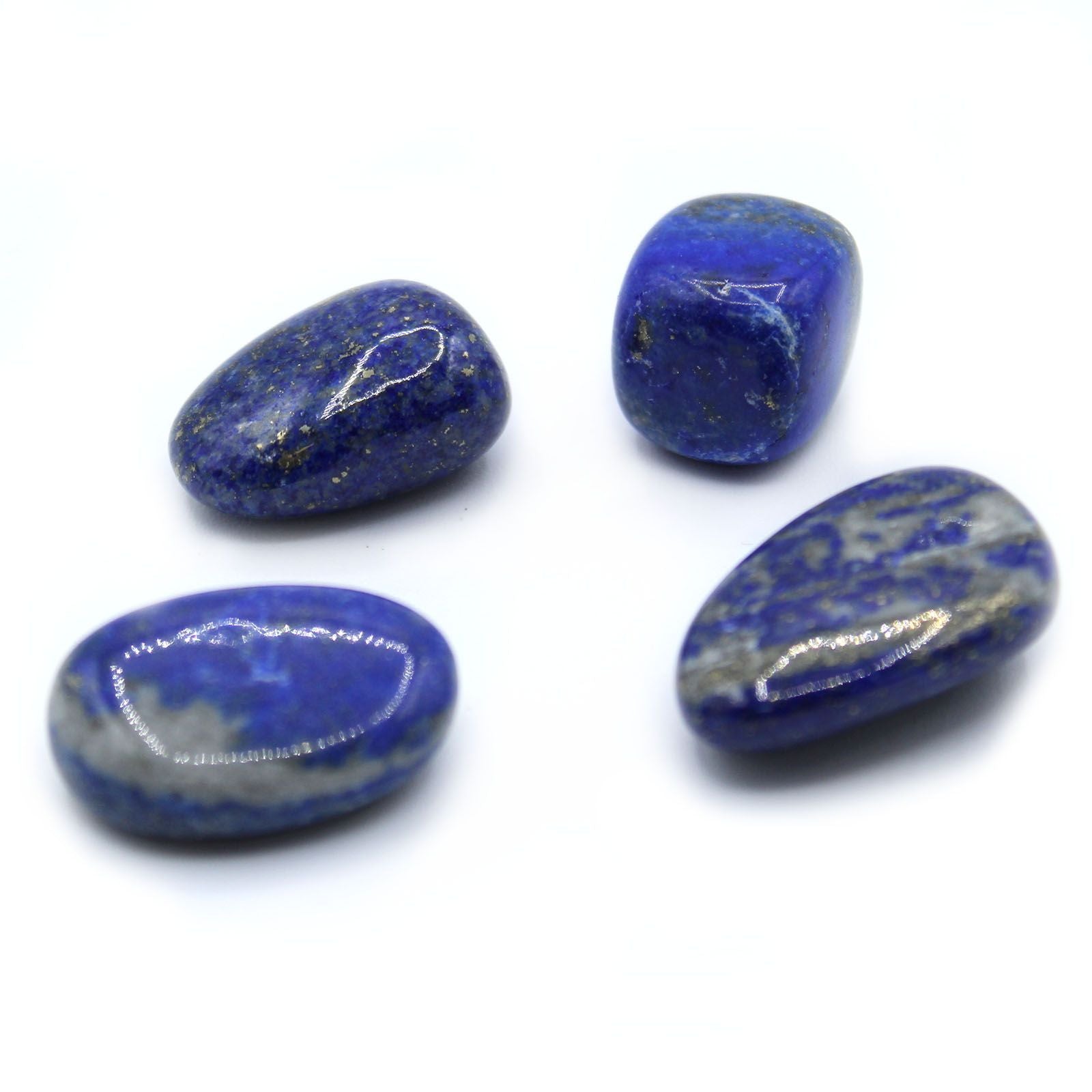 Deep blue polished Lapis Lazuli tumble stone with golden pyrite inclusions and a smooth finish.