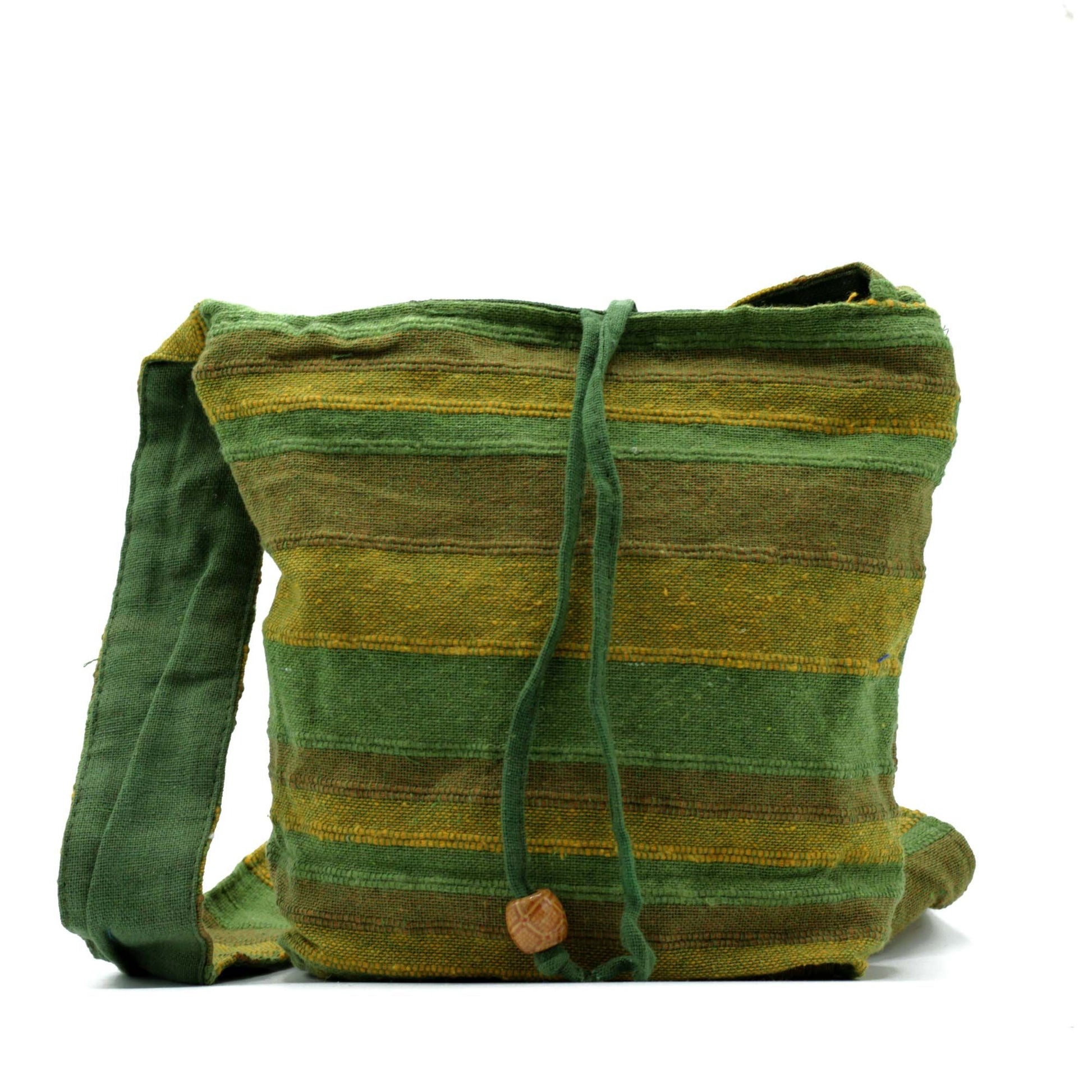 Vibrant blue and patterned Nepal sling bag with a long shoulder strap and secure zip closure.