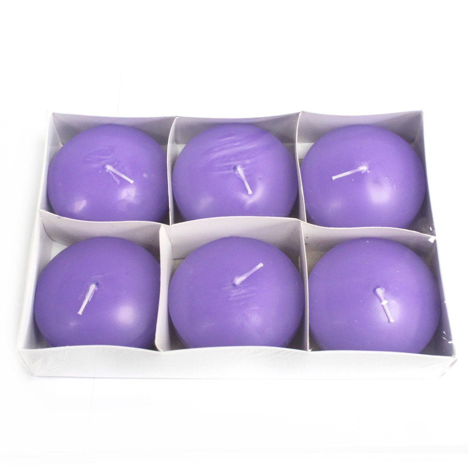 A large round lilac-coloured floating candle with a smooth finish and a single wick.