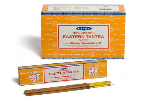 Box and hand-rolled incense sticks with a rich floral and spicy scent profile on a neutral background.