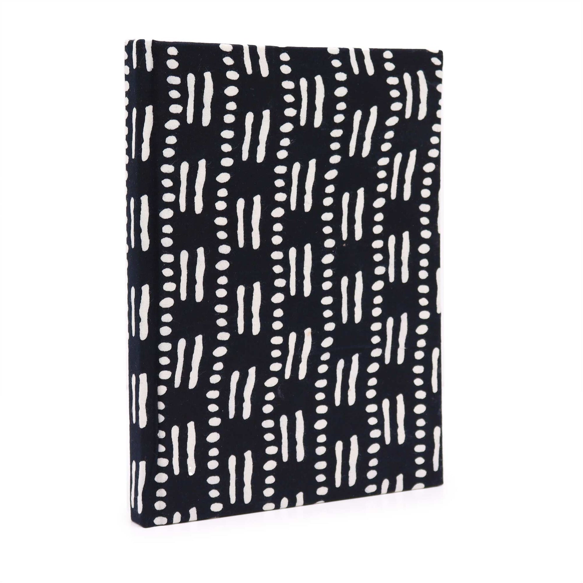 Handcrafted cotton bound notebook featuring a black and white dots and dashes pattern with a textured fabric cover.