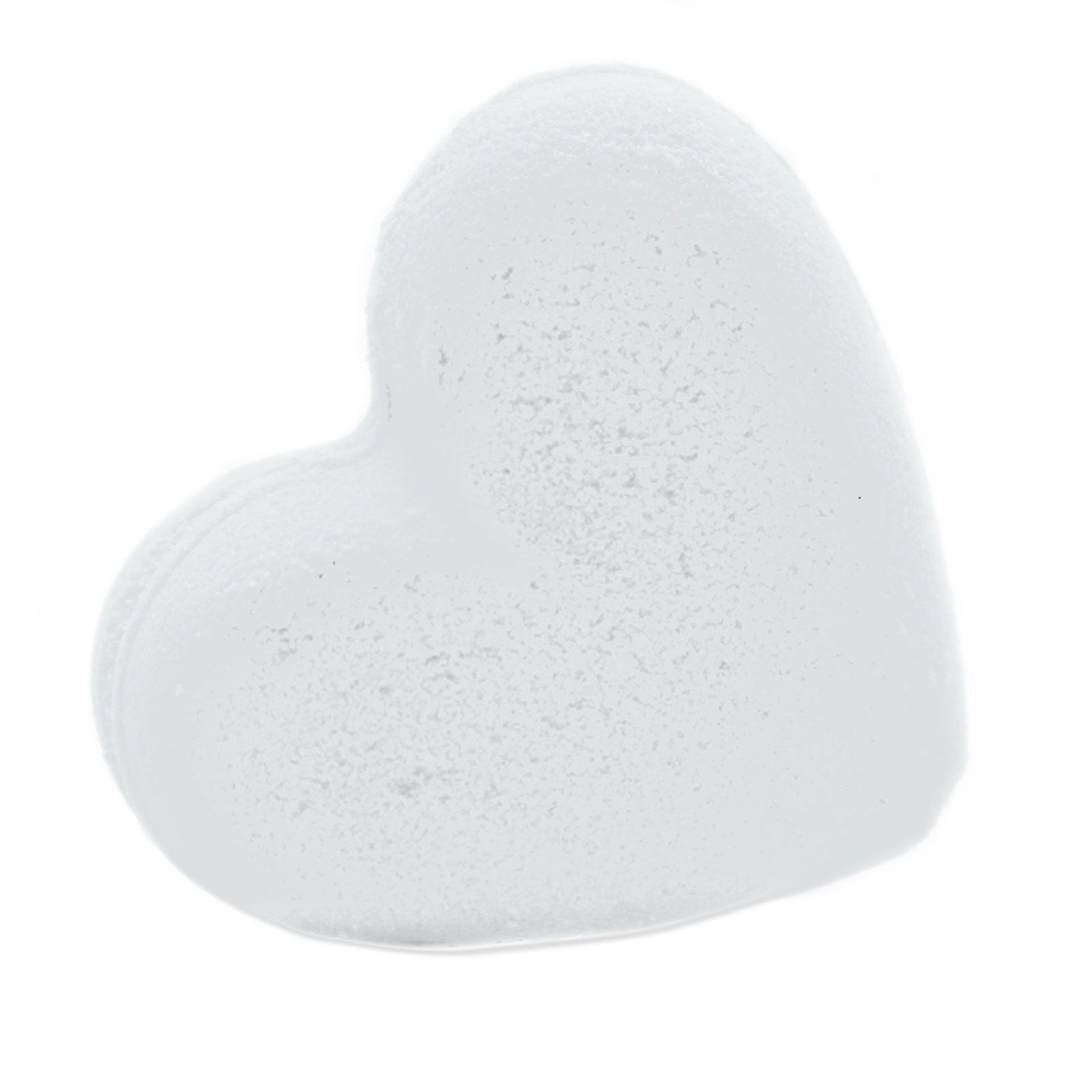 A white heart-shaped bath bomb with a smooth texture, perfect for a relaxing and fragrant self-care ritual.
