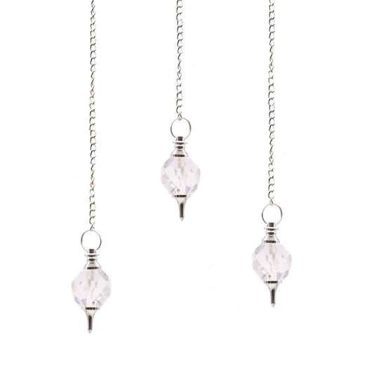 Clear faceted rock quartz crystal pendulum suspended from a delicate silver chain.