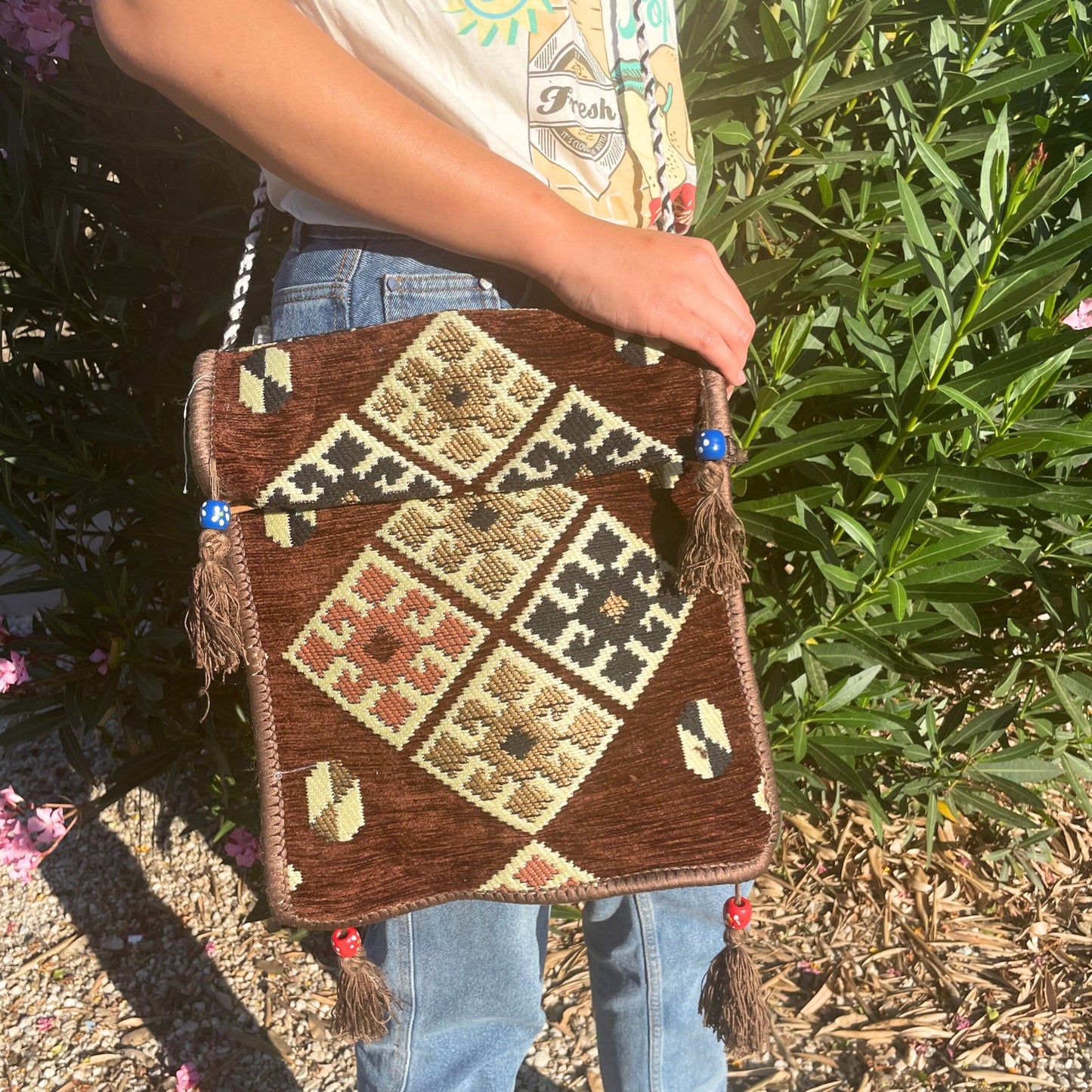Handcrafted chocolate brown messenger bag featuring traditional Turkish Kilim woven patterns and vibrant cultural designs.