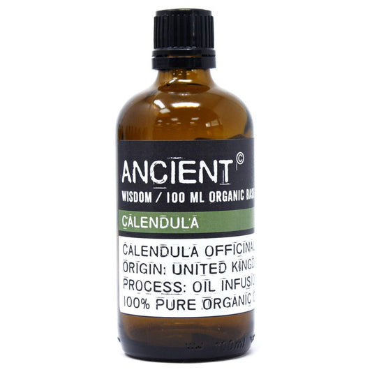 Clear glass bottle containing 100ml of golden organic calendula base oil for aromatherapy and skincare.