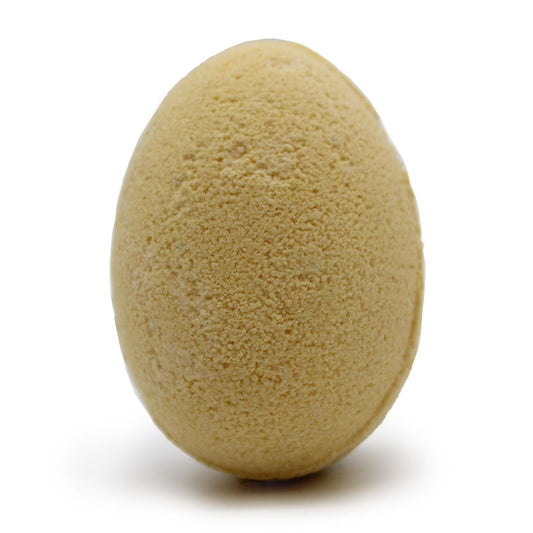 Yellow egg-shaped bath bombs arranged in a protective cardboard tray.