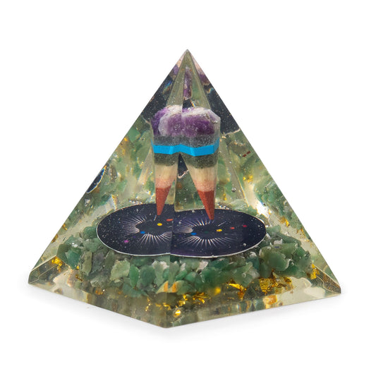 Clear resin orgonite pyramid containing green aventurine chips, golden accents, and a suspended metal pendulum.