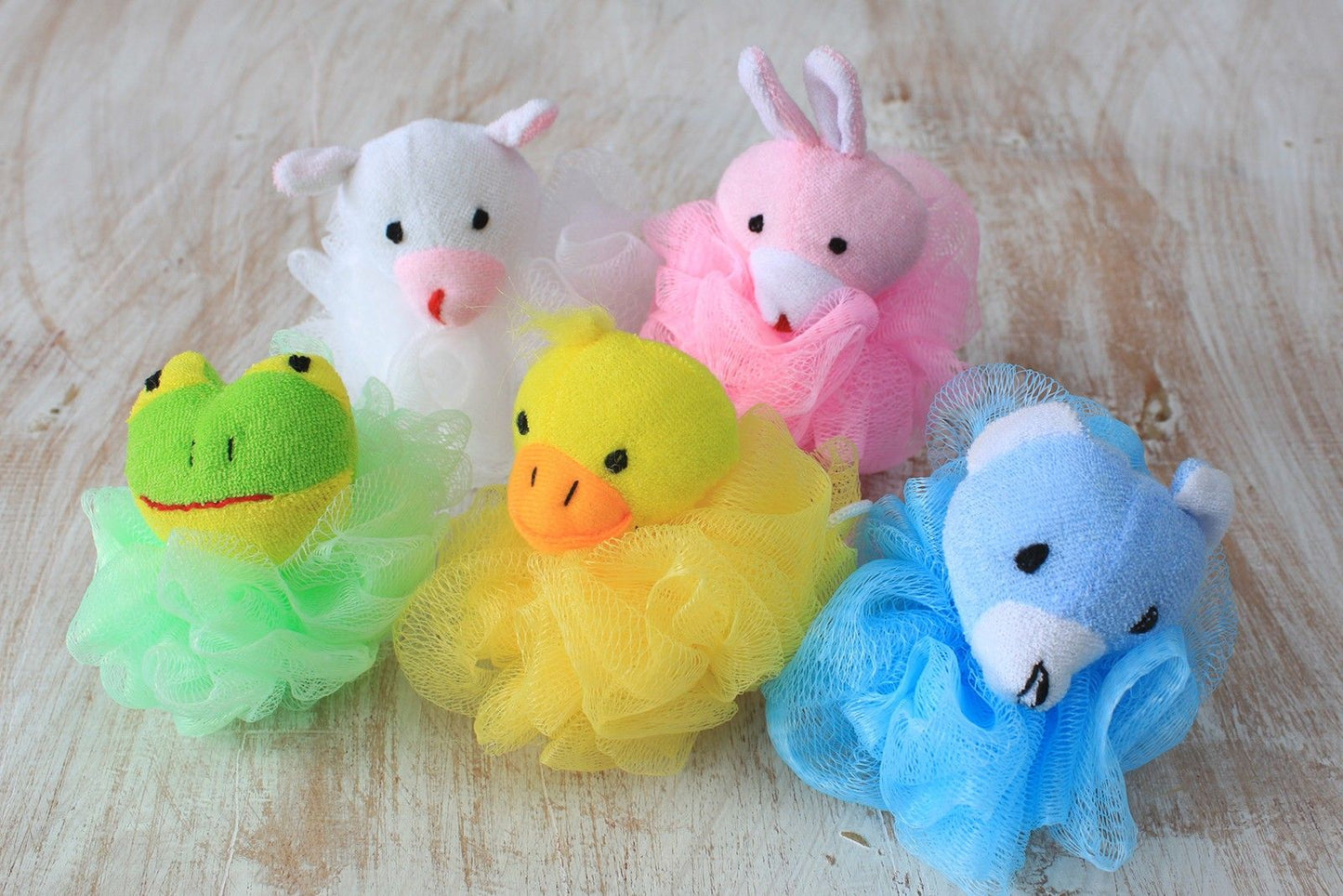 Soft cotton animal-themed bath scrunchie in a bright, playful colour for gentle exfoliation during bathing.