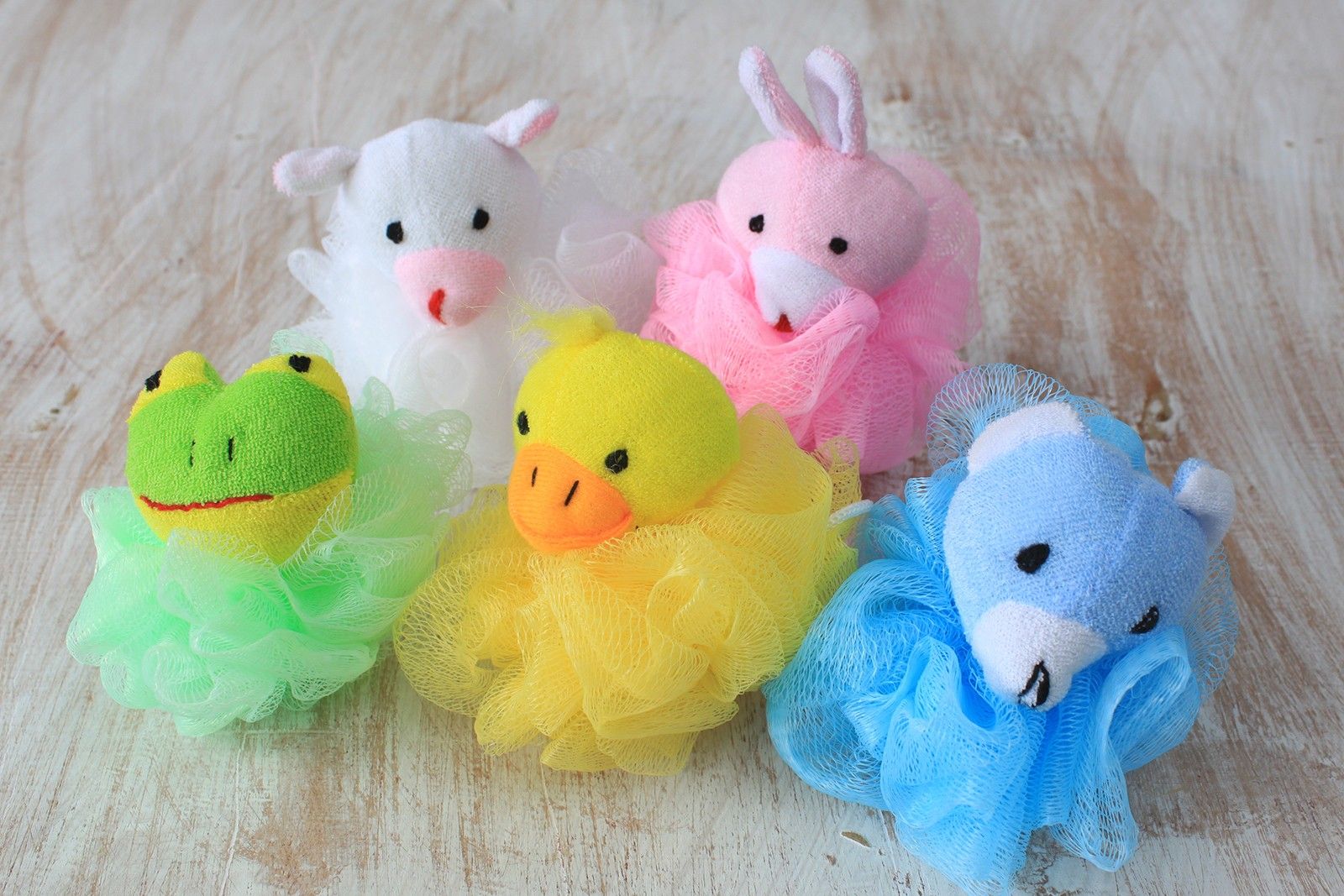Soft cotton animal-themed bath scrunchie in a bright, playful colour for gentle exfoliation during bathing.
