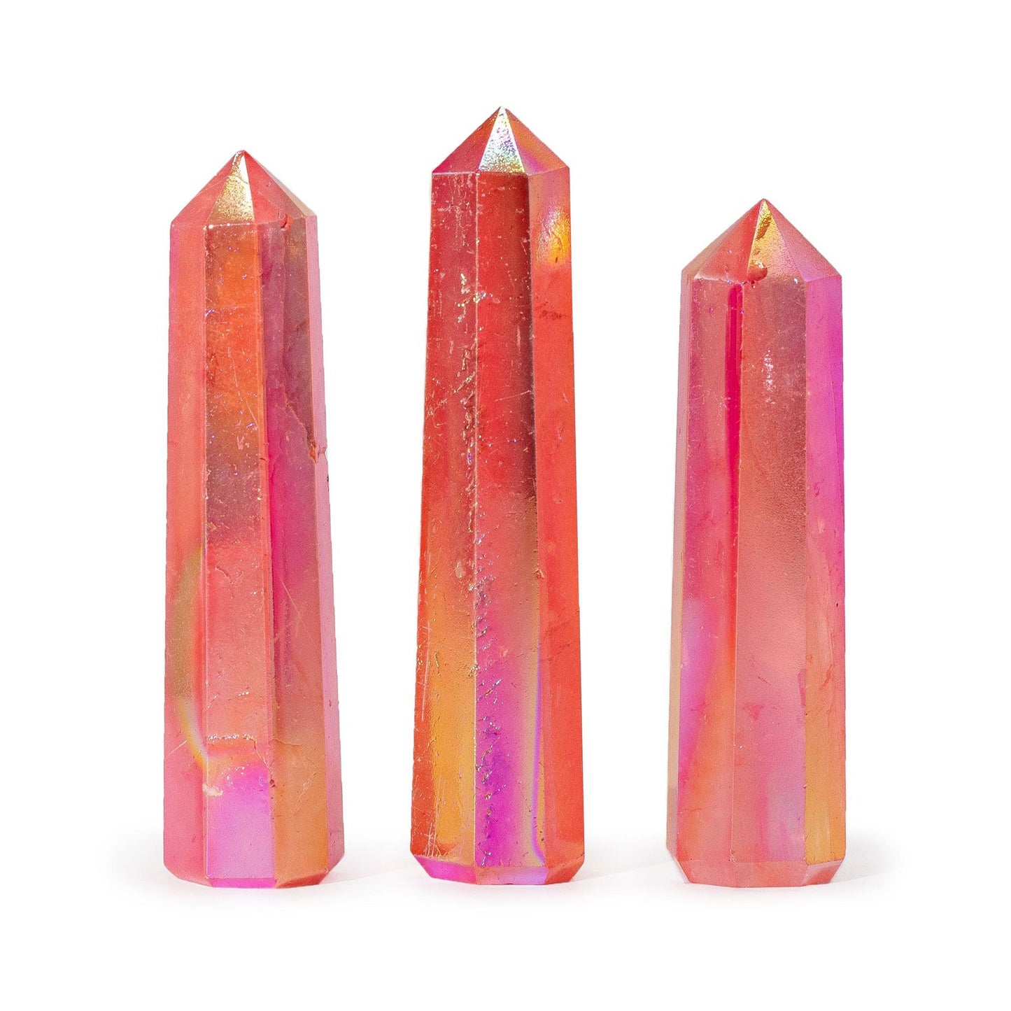 Polished peach aurora crystal quartz obelisk point with shimmering pink and golden iridescent tones.