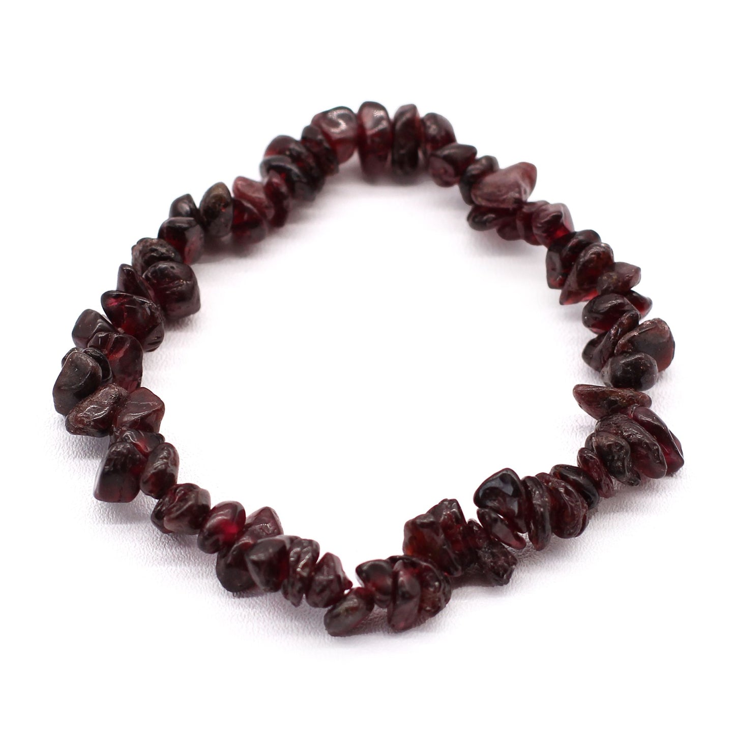 Handmade chipstone bracelet featuring polished deep red blood garnet gemstones on a clear elastic cord.