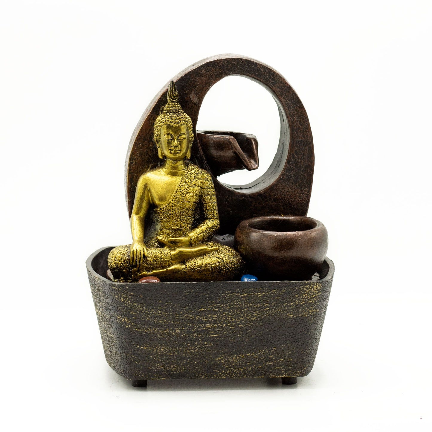 Golden Buddha statue seated in a dark bowl with water cascading into tiered pots, a serene tabletop fountain.