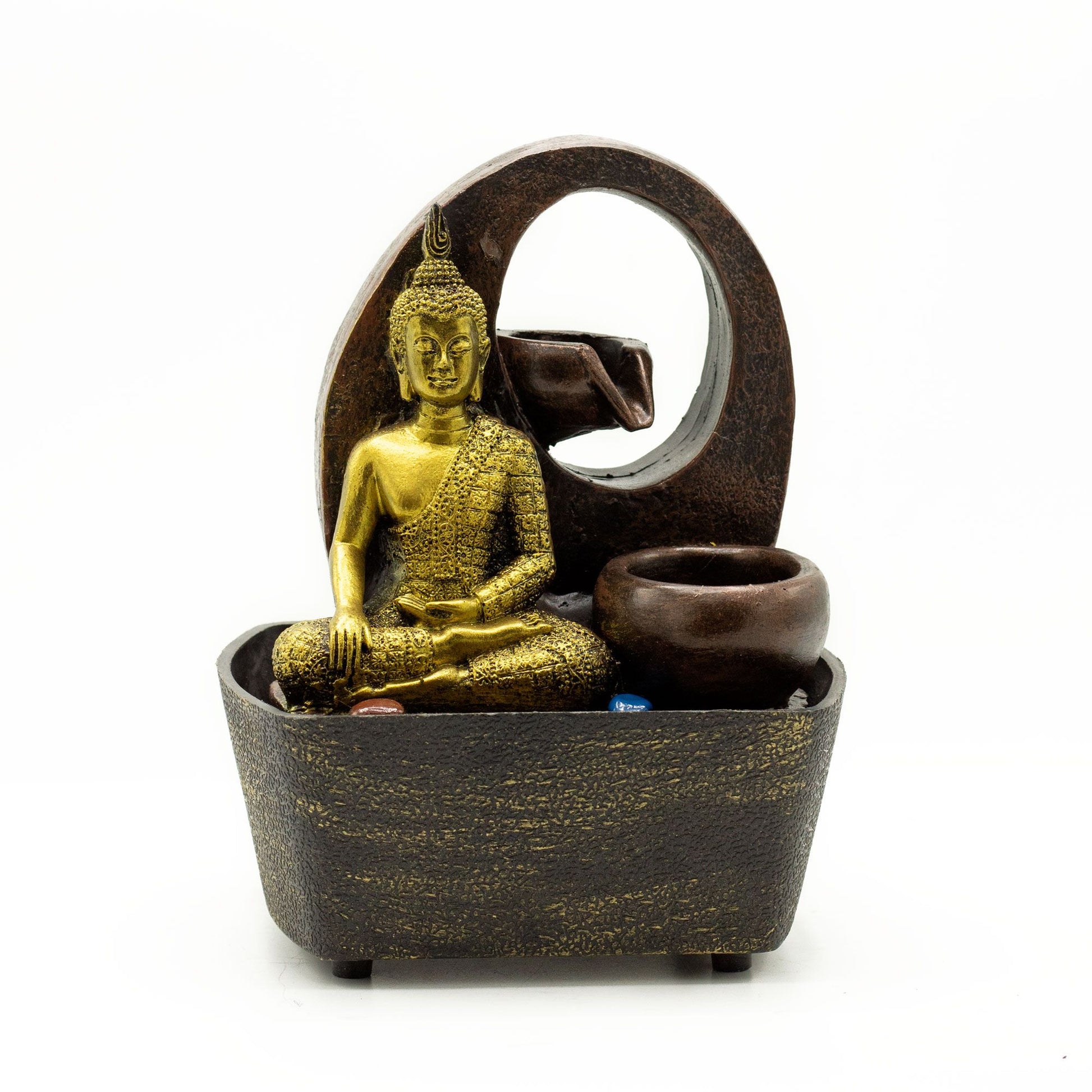 Golden Buddha statue seated in a dark bowl with water cascading into tiered pots, a serene tabletop fountain.