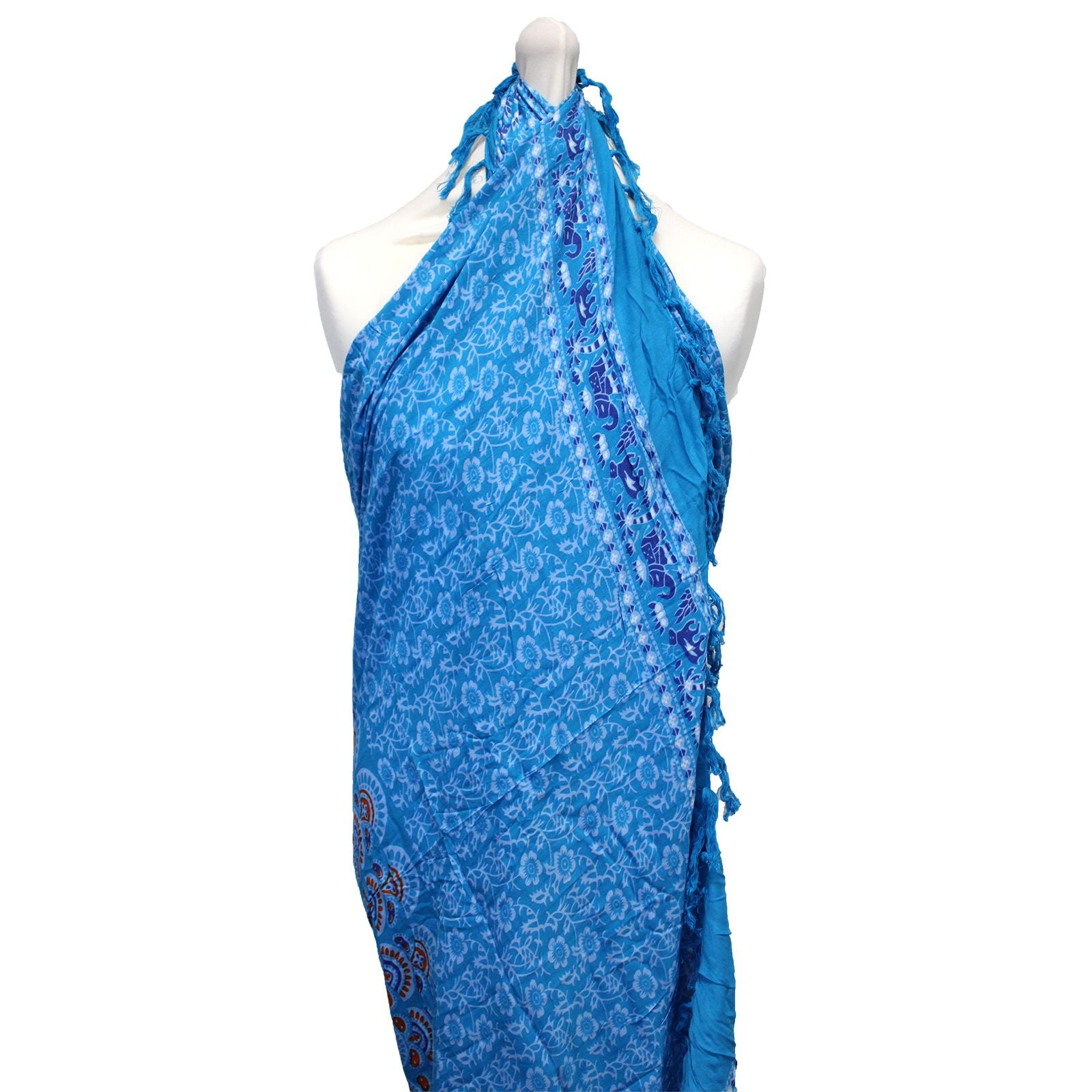 Vibrant teal and orange sarong featuring an intricate circular mandala pattern and decorative fringed edges.