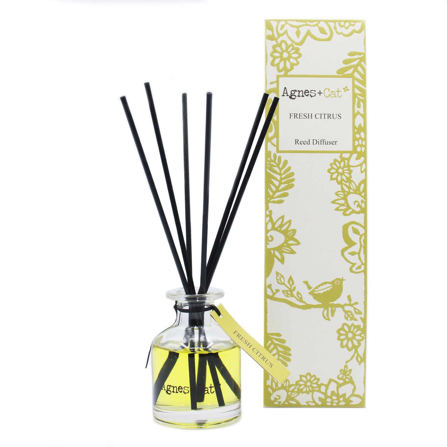 Clear glass reed diffuser bottle with 140ml of citrus-scented oil and natural wooden reeds on a neutral background.
