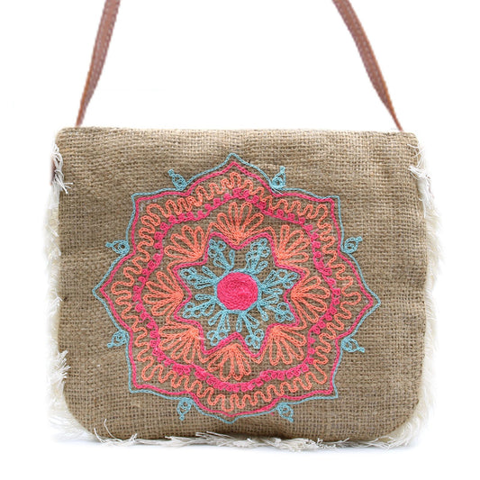 Soft washed jute handbag featuring a detailed Mandela embroidery design and a stylish cotton fringe trim.