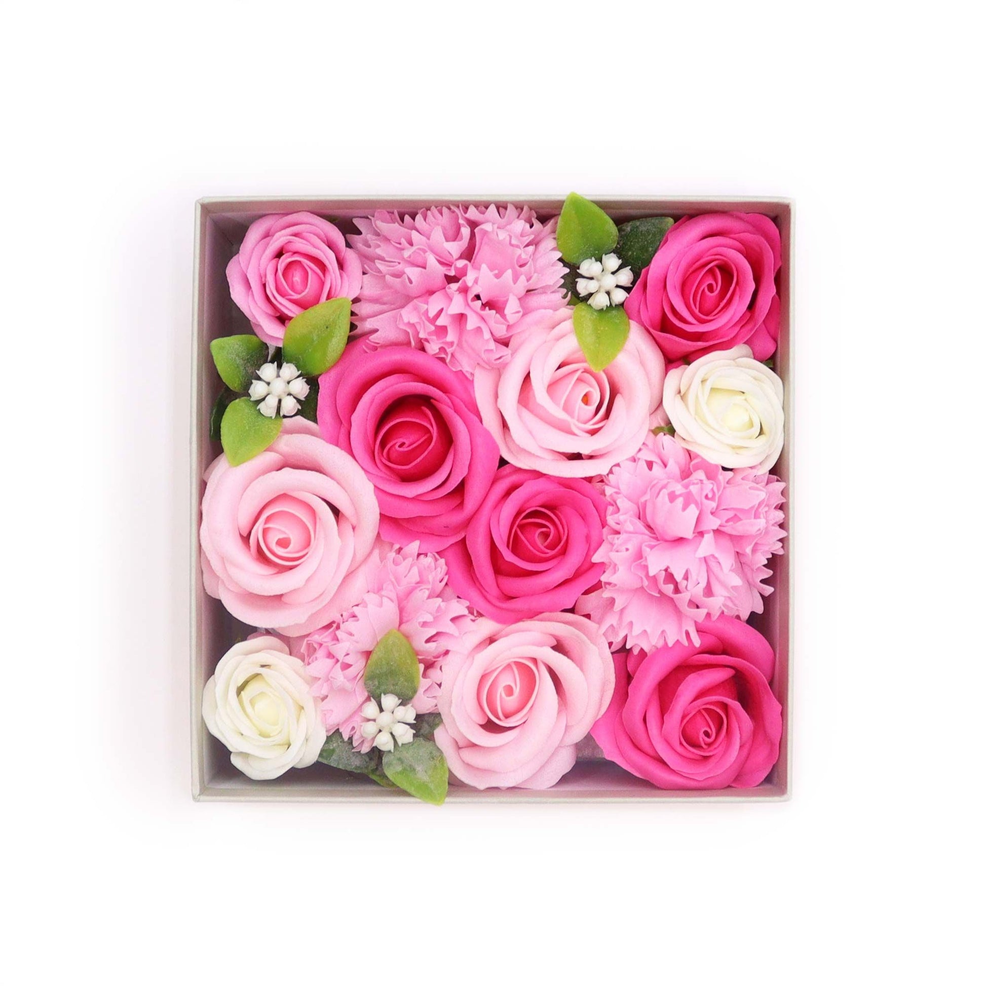 Square gift box filled with delicate pink soap flowers and roses for a new baby gift.