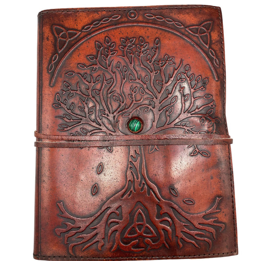 Handcrafted brown leather journal with an embossed Tree of Life design, a green stone accent, and a wrap-around tie.