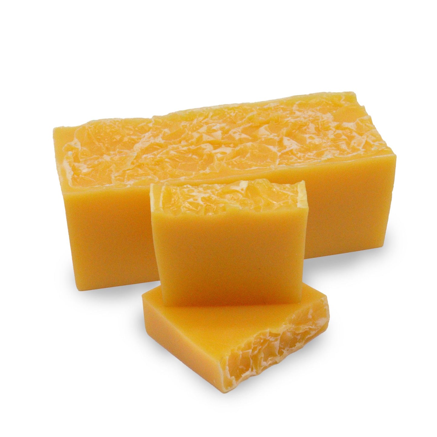 Hand-crafted orange and gold textured soap bar wrapped in traditional waxed paper.