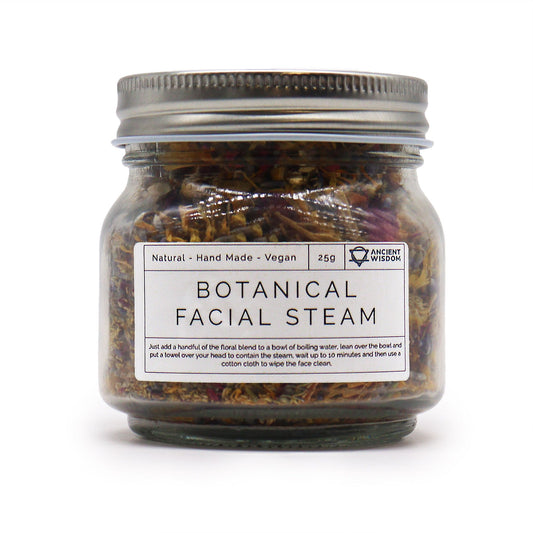 Clear glass jar filled with a colourful blend of dried lavender, rose petals, chamomile, and calendula flowers.