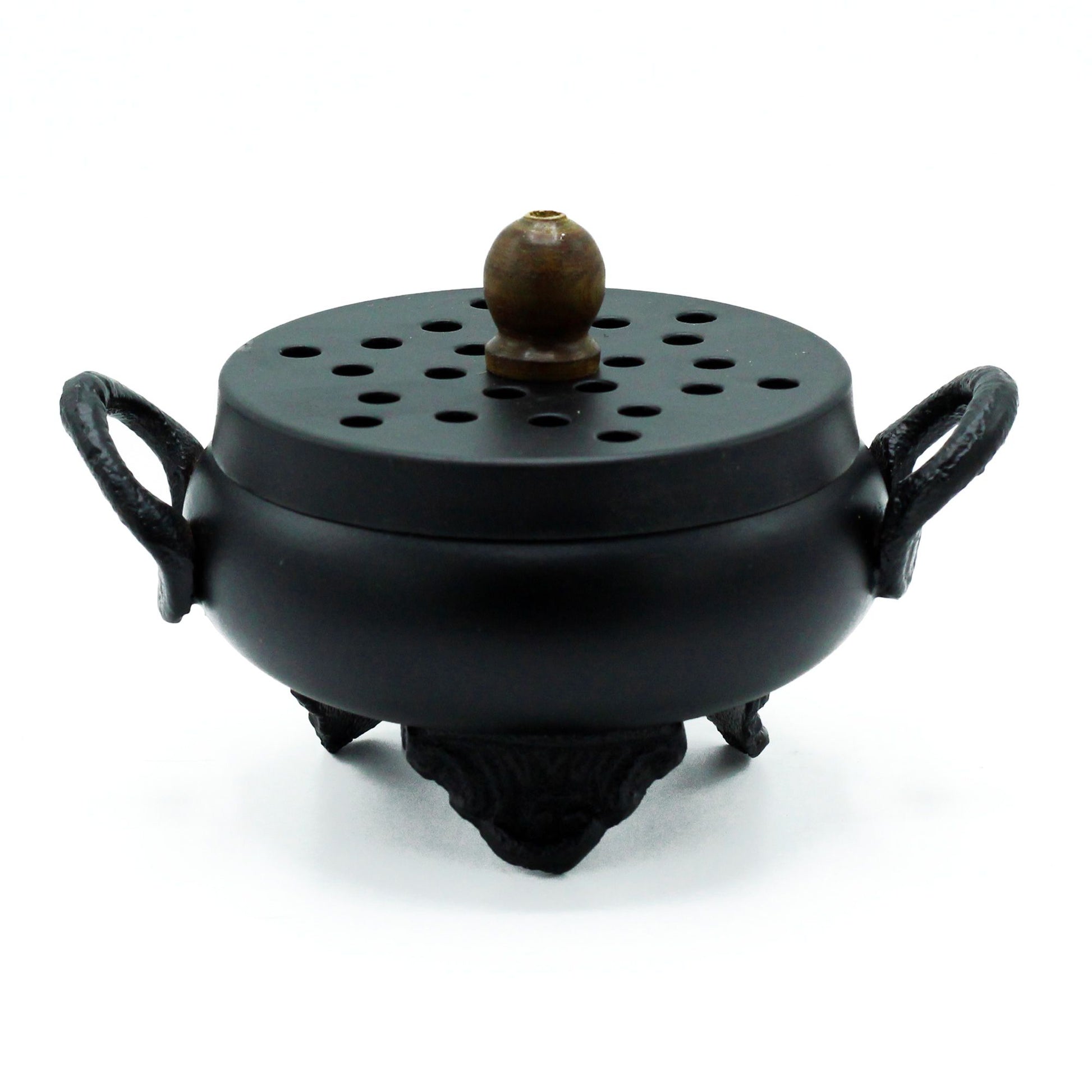 Rustic black cast iron cauldron incense burner with a traditional three-legged design and side handles.