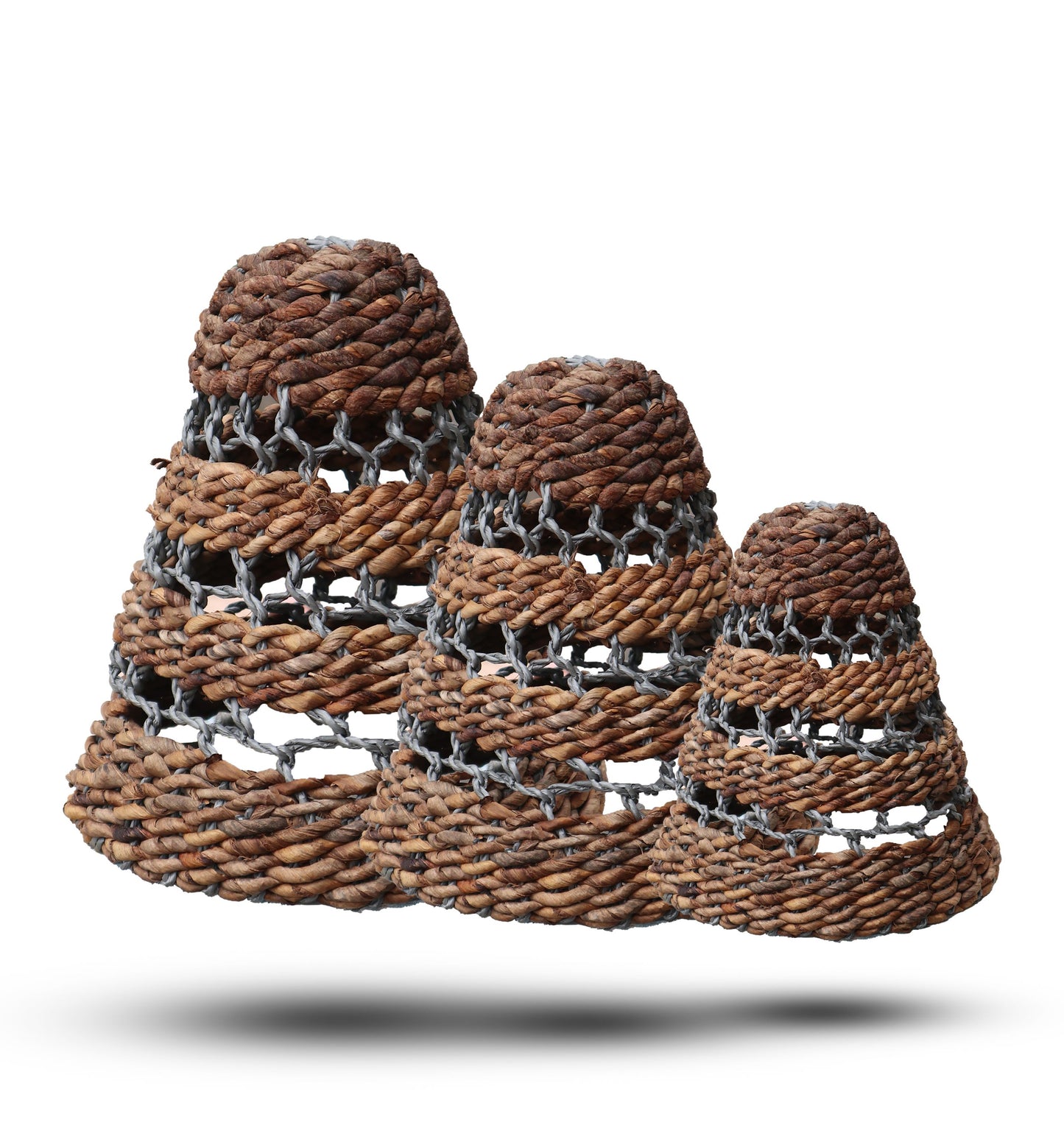 Three tiered conical lamp shades handcrafted from natural textured banana leaf and grey raffia fibers.