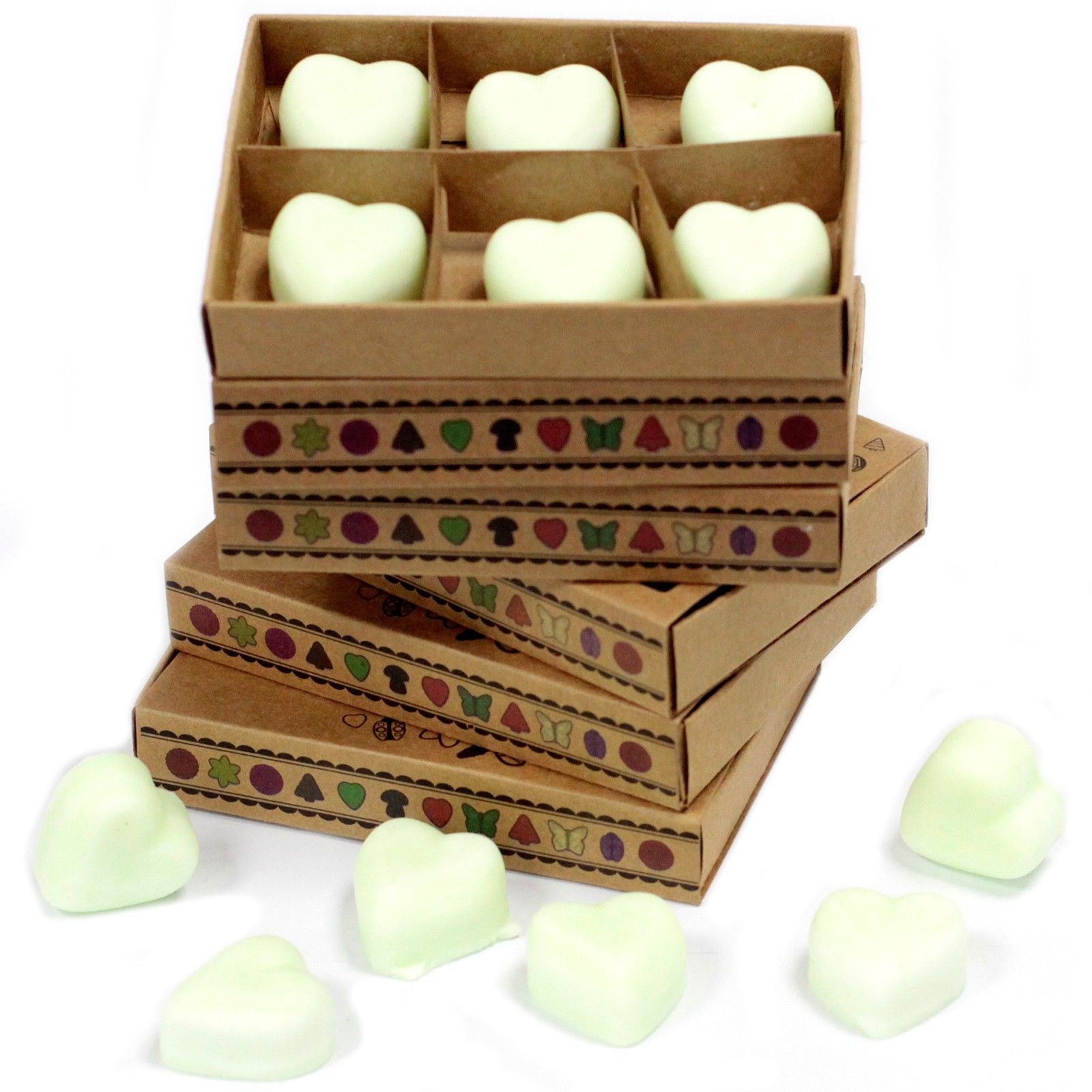 Six heart-shaped cream-coloured wax melts arranged neatly inside a small kraft matchbox with a simple design.