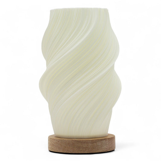 Sleek modern lamp with a fluid white spiral design resembling a twisted cloud on a minimalist base.
