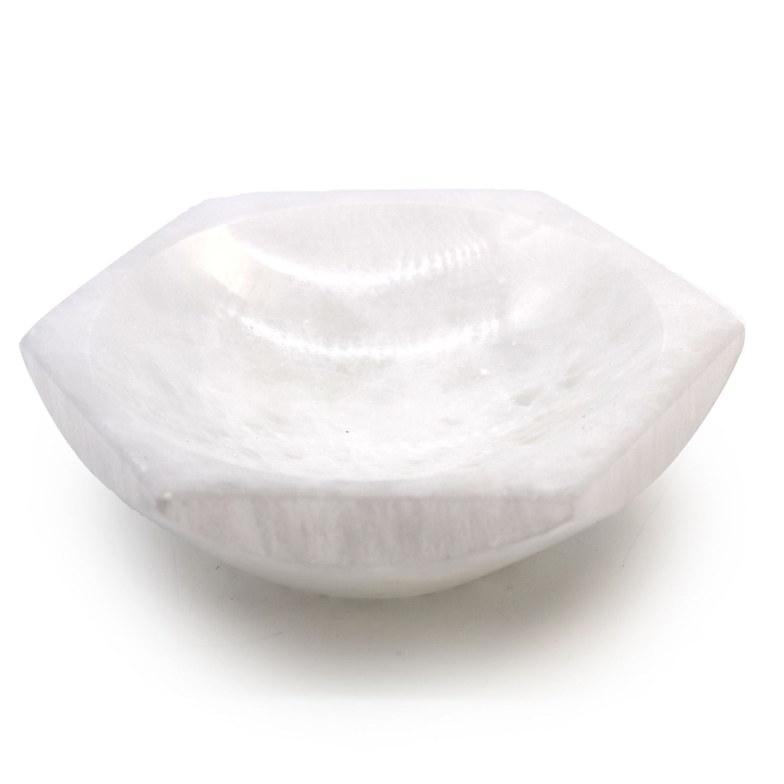Hexagonal white selenite crystal bowl with a smooth translucent finish and natural mineral texture.