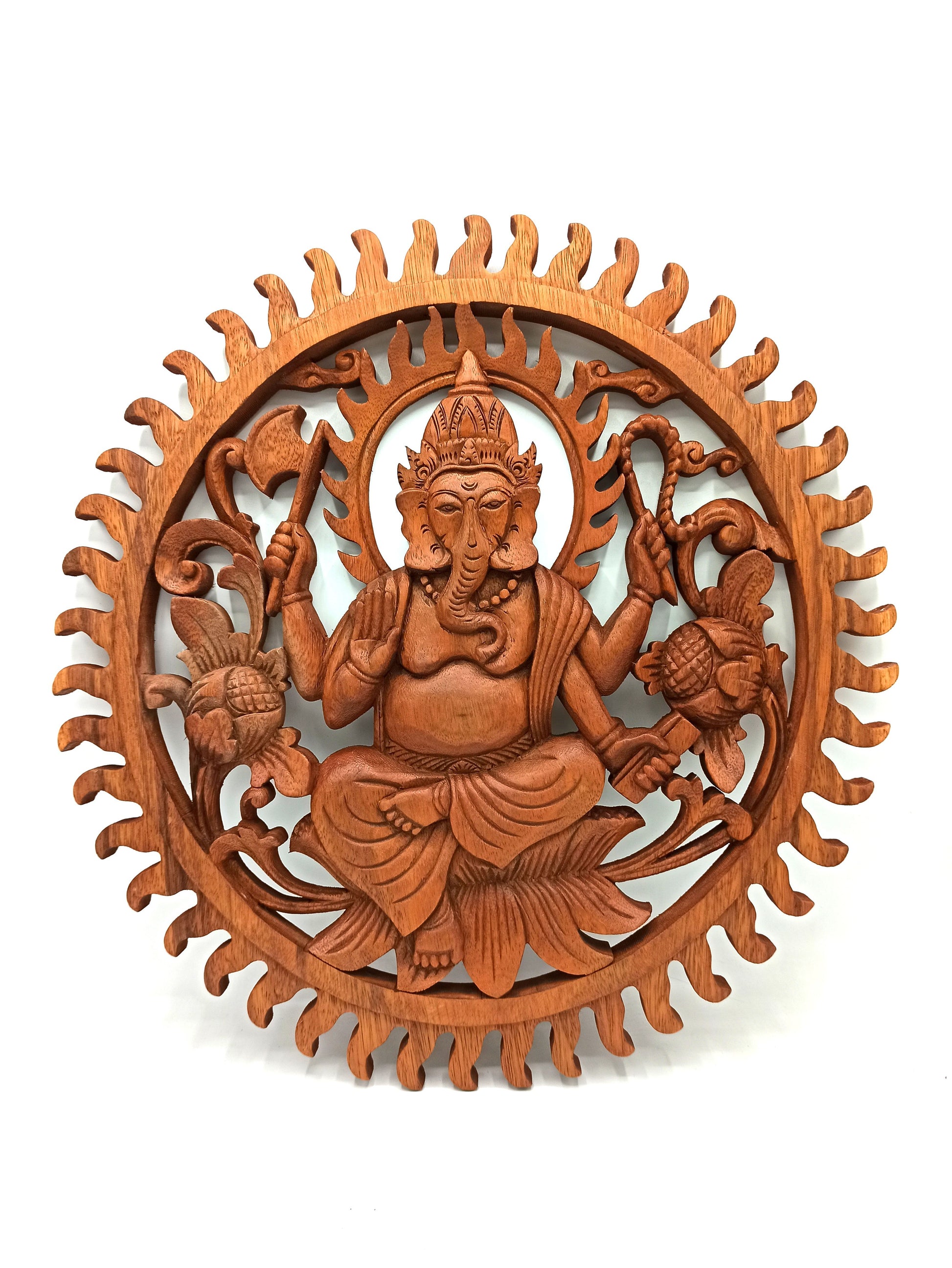 Intricately hand-carved circular wooden wall panel featuring the Hindu deity Lord Ganesha.