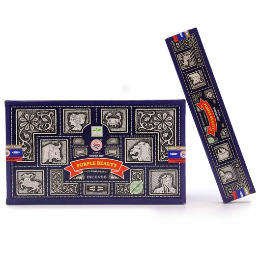 A pack of Super Hit Purple Beauty Nag Champa incense sticks with vibrant purple packaging on a neutral background.