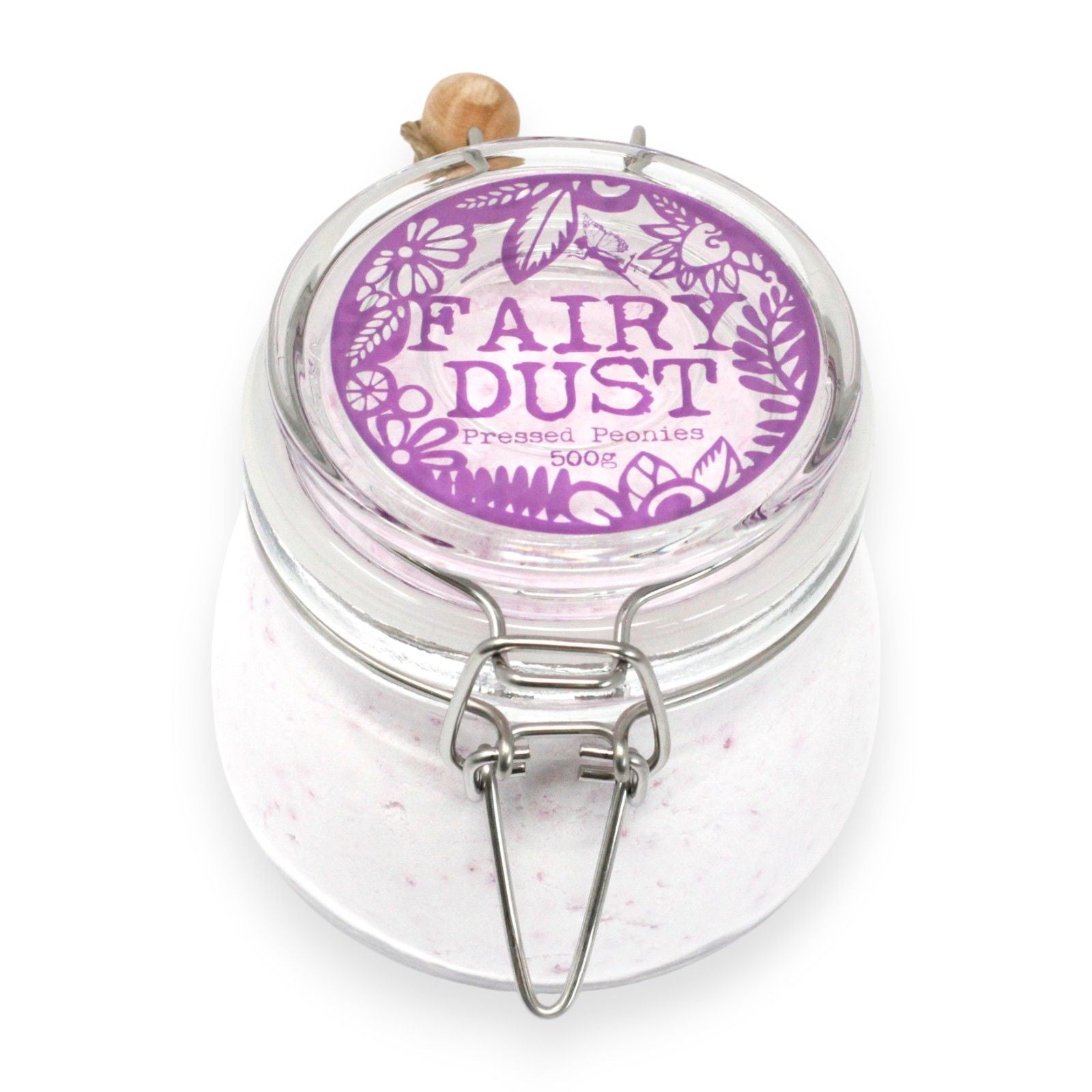 Fine pink bath powder in a glass jar, evoking the delicate scent of blooming peonies for a luxurious soak.