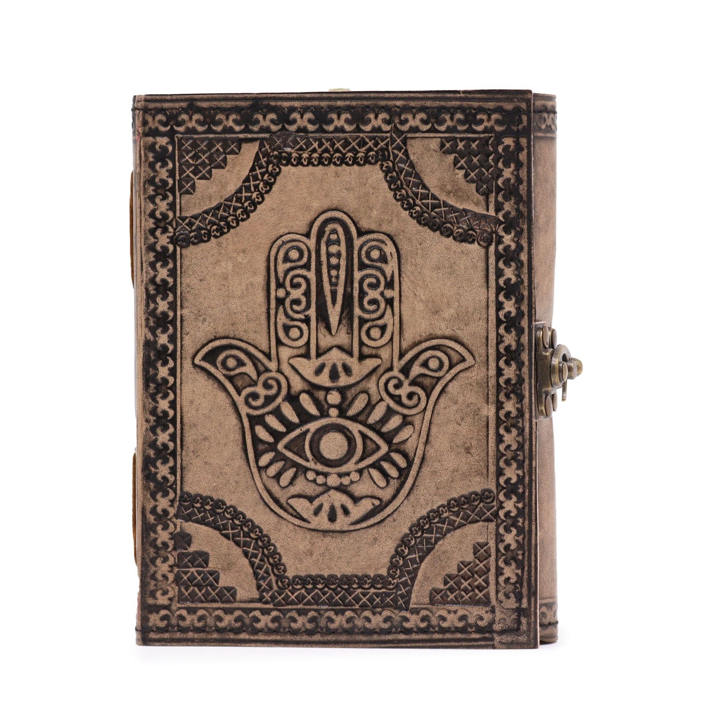 Antique grey leather notebook featuring an embossed Hamsa hand design with decorative stitched edges on a dark surface.