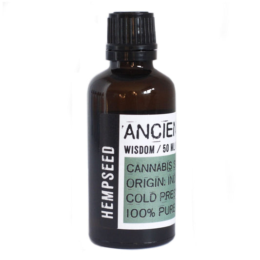 Amber glass bottle of green hempseed oil with a black screw cap, showing its natural light to medium green colour.