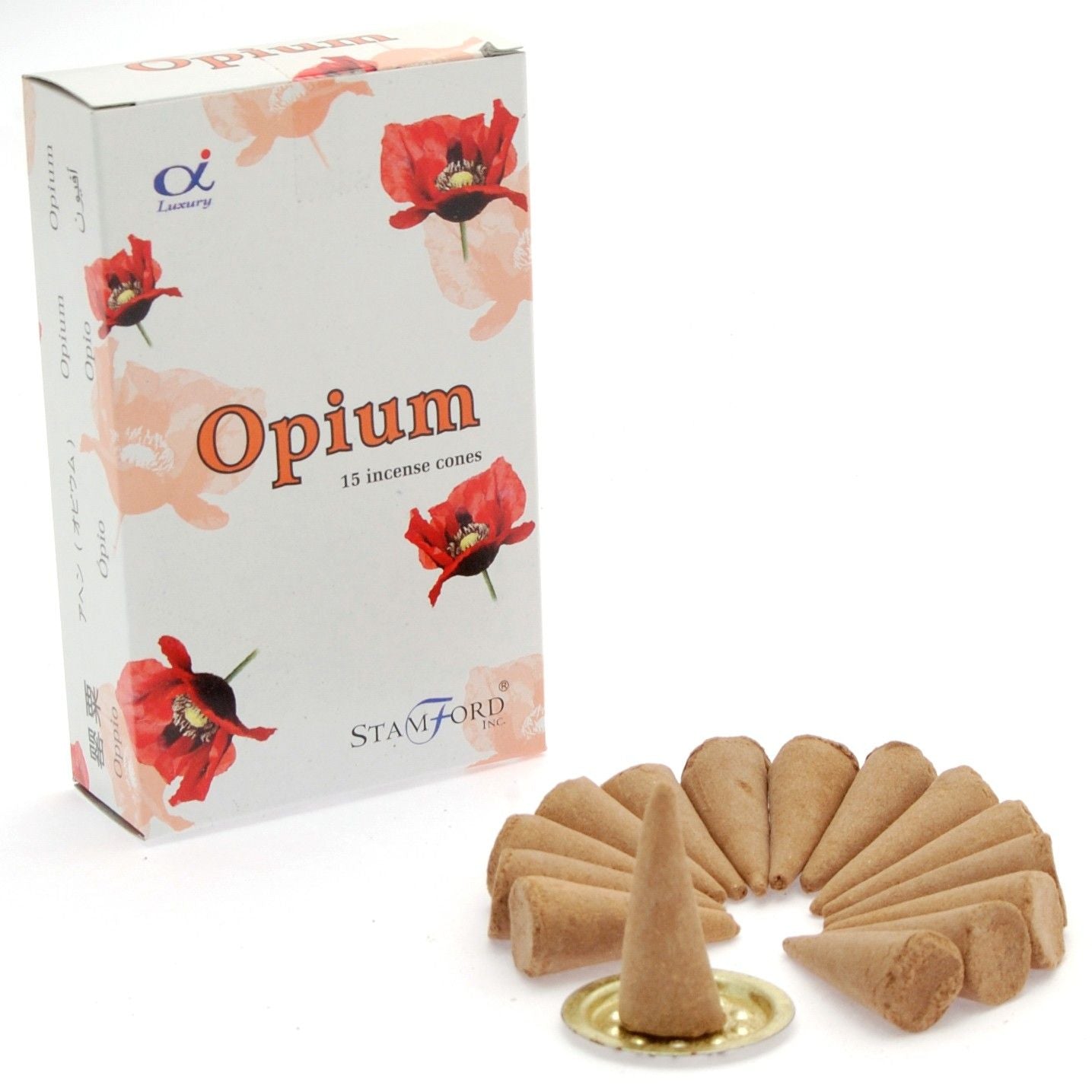 A stack of dark aromatic incense cones releasing a gentle trail of smoke in a serene setting.