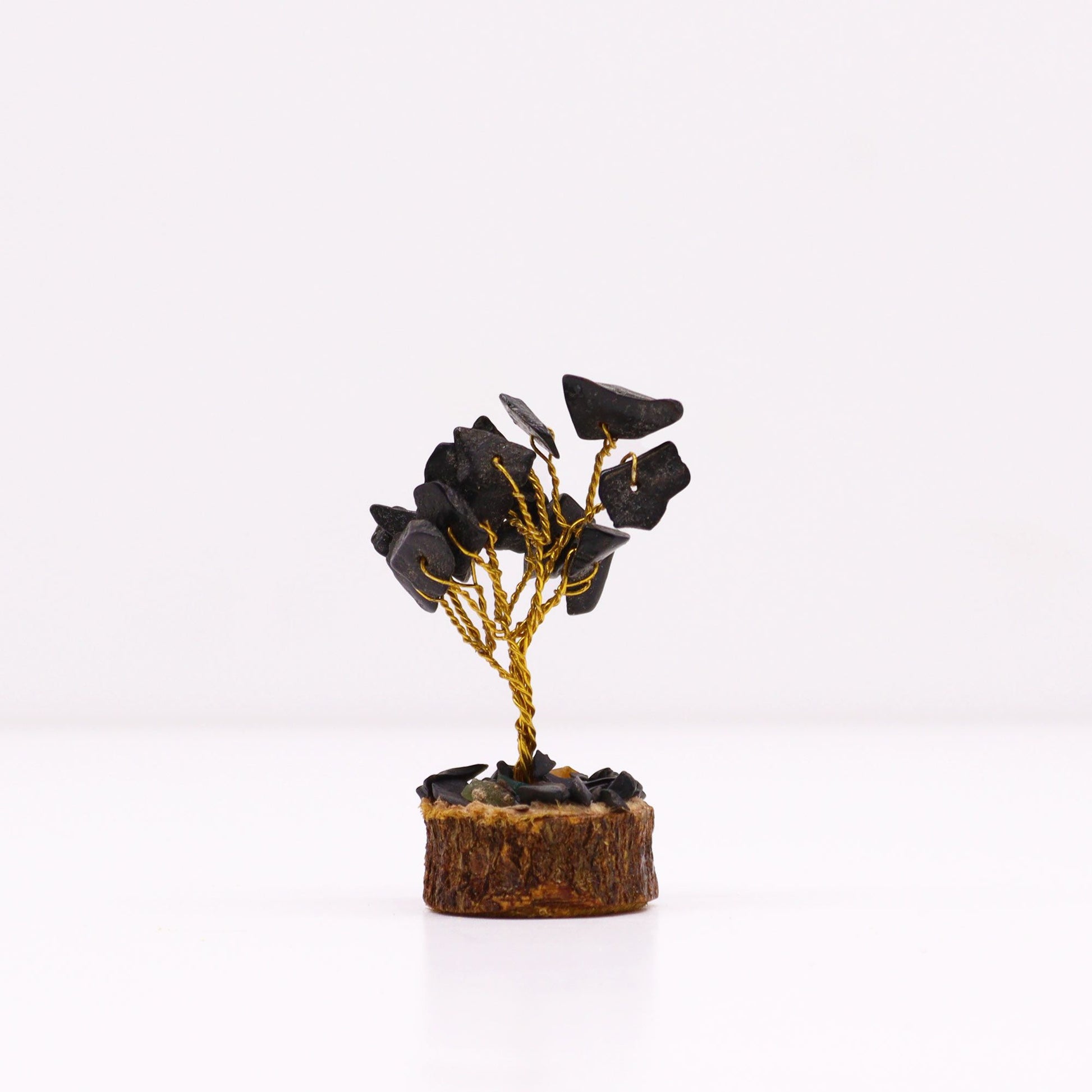 Delicate mini gemstone tree featuring polished black agate leaves on wire branches with a natural wood base.