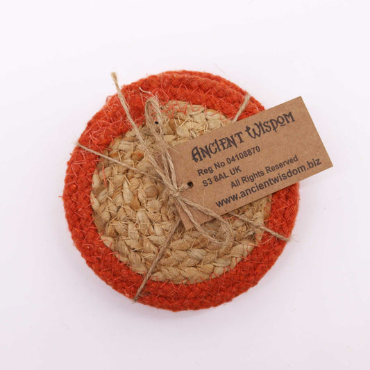 Set of four circular hand-woven natural jute and cotton coasters with a decorative earthy clay-coloured border.