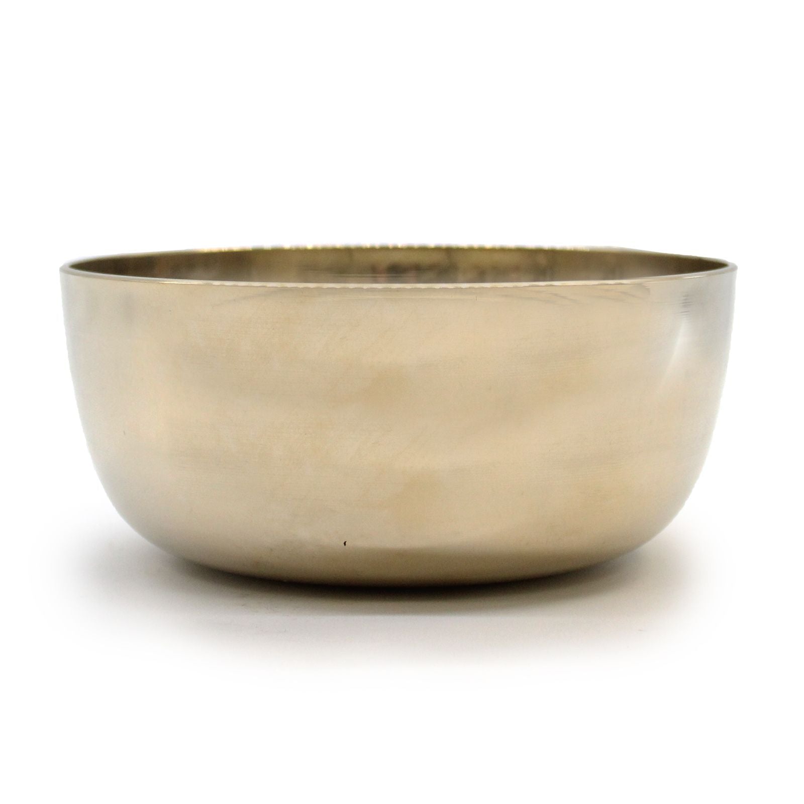 Large polished brass Tibetan singing bowl showing a smooth golden finish and traditional rounded shape.