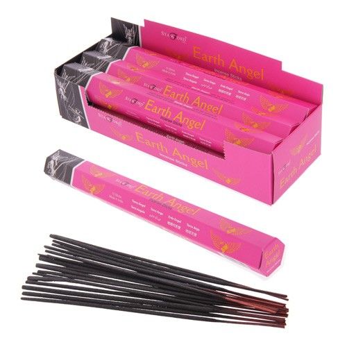 Pack of hand-rolled incense sticks with natural earthy tones on a neutral background.