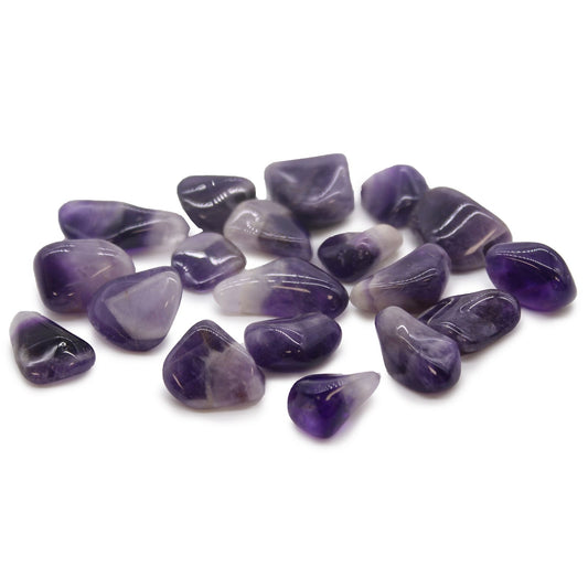 Smooth medium-sized Grade A banded amethyst tumble stone showing beautiful purple and white quartz chevron patterns.