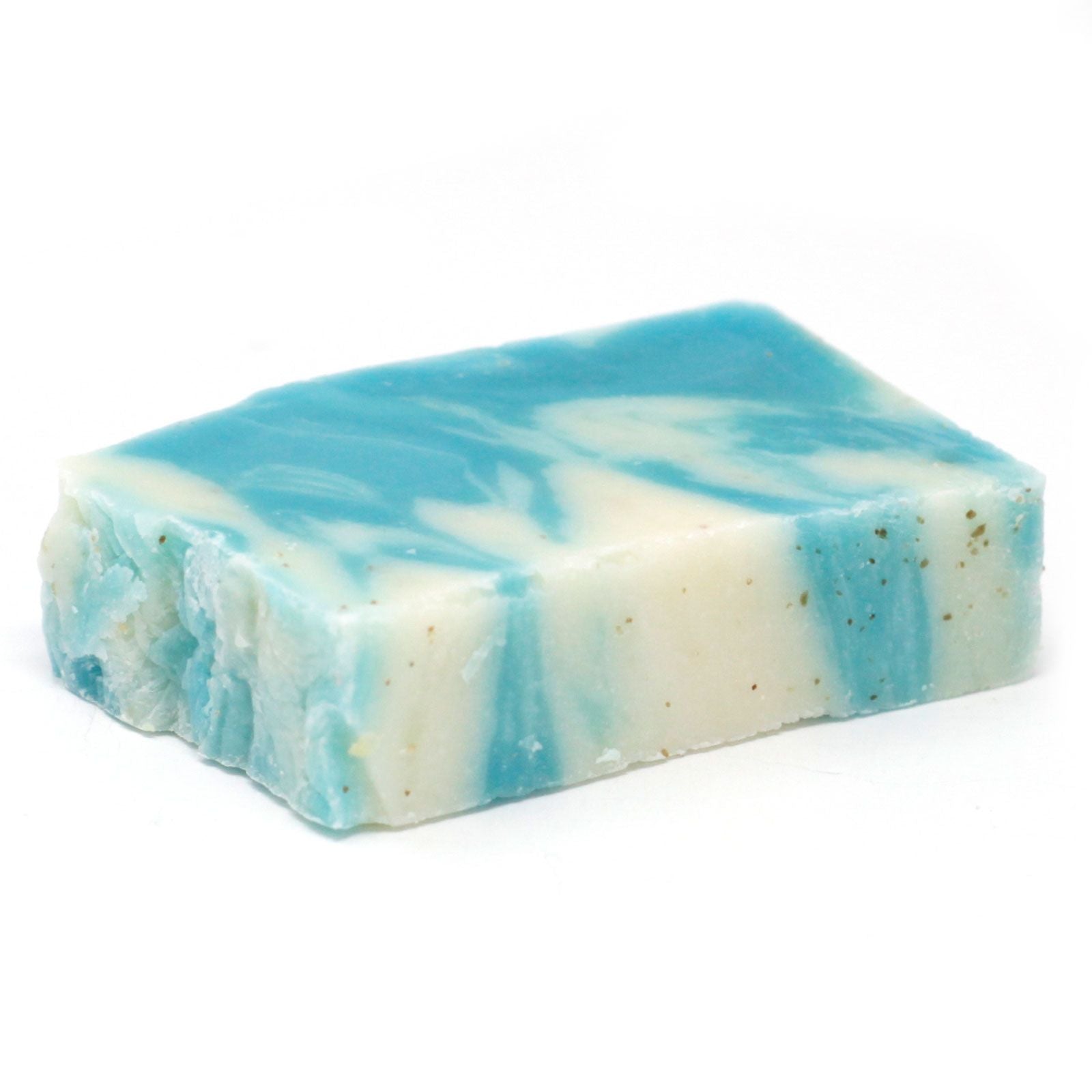 Textured green artisan soap slice infused with seaweed pieces, showing a rustic cold-process finish.